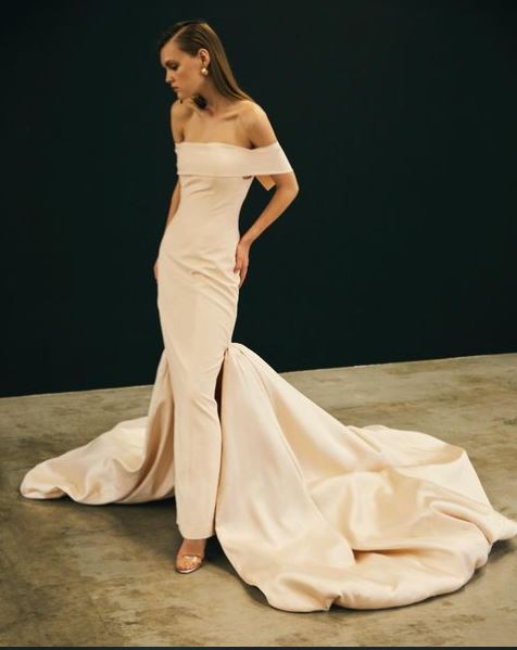 Off shoulder skinny gown with oversized statement train