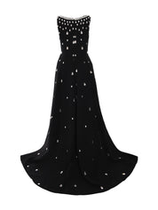 Fully embroidered black dress with overskirt.