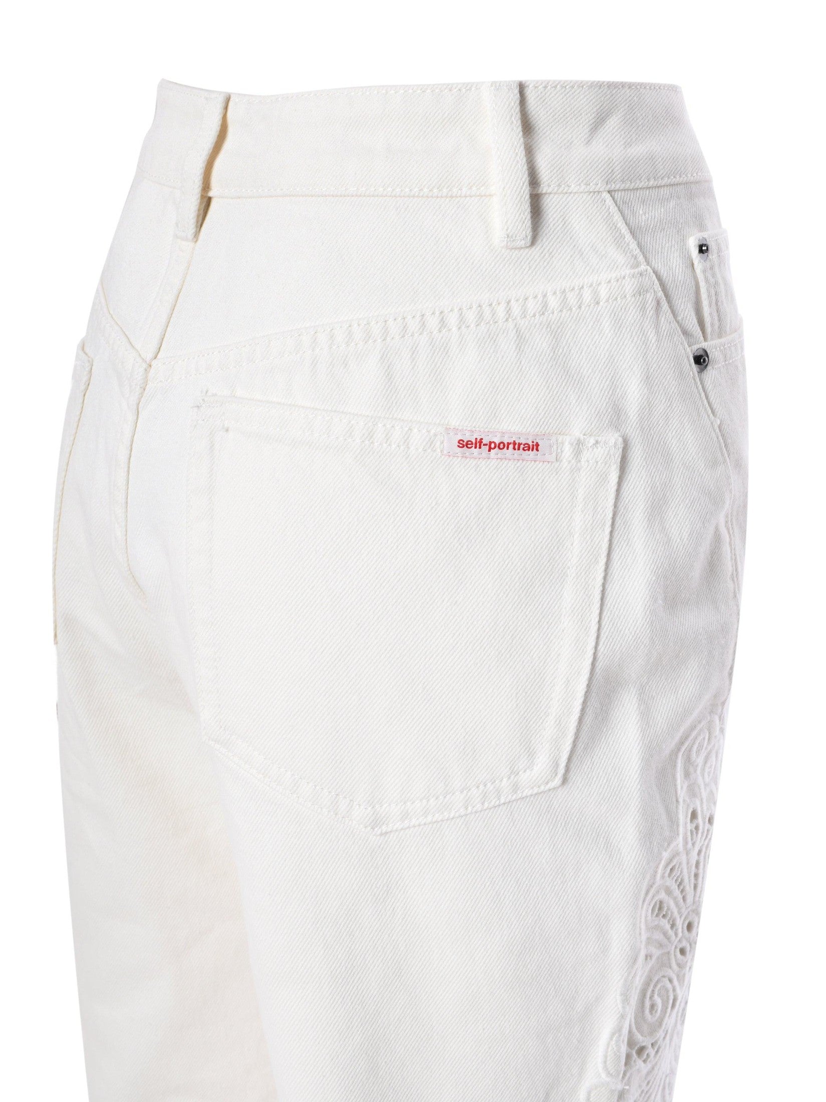 White cutwork denim jeans