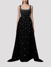 Fully embroidered black dress with overskirt.