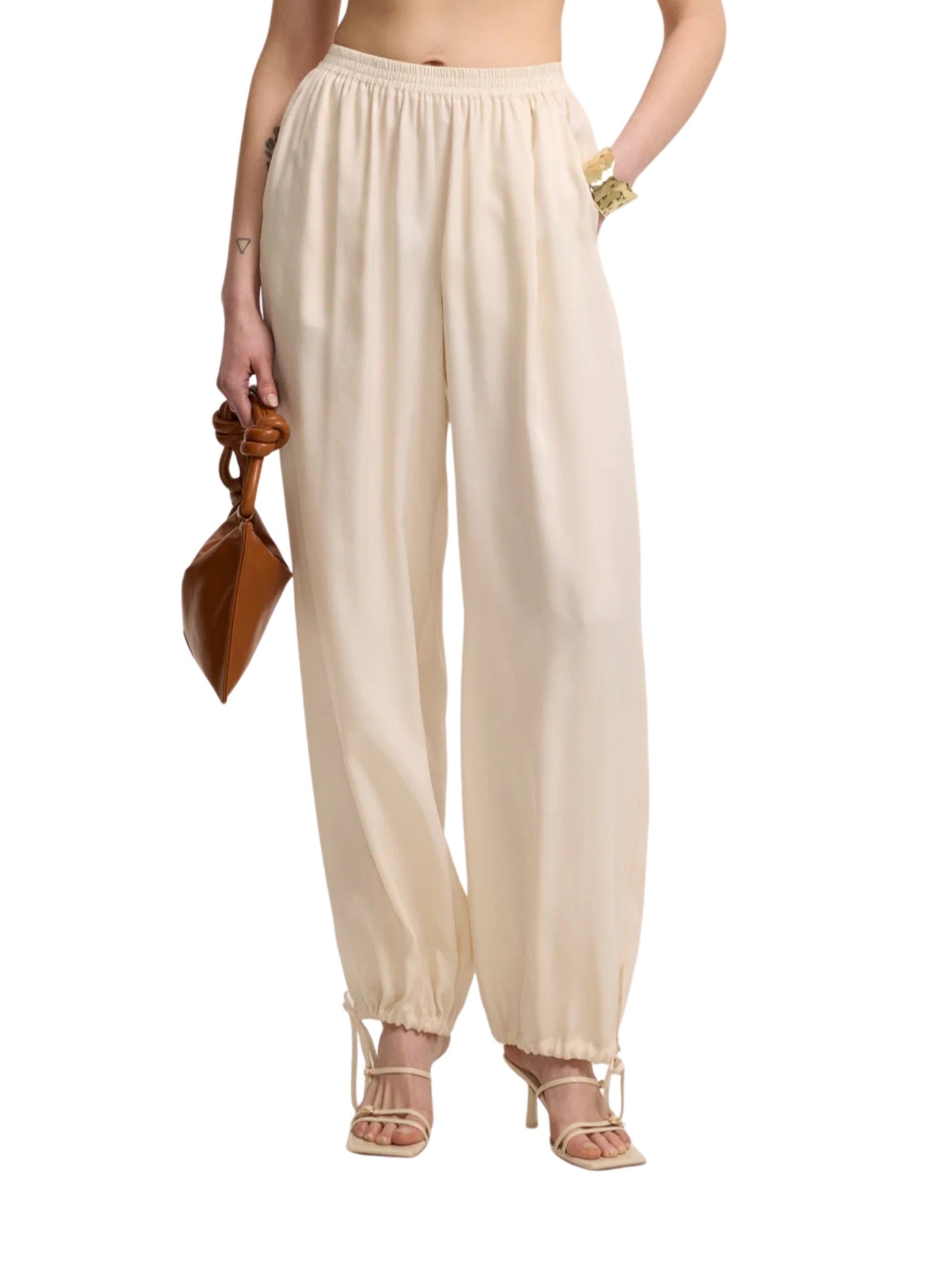 Light beige trousers with drawstring legs