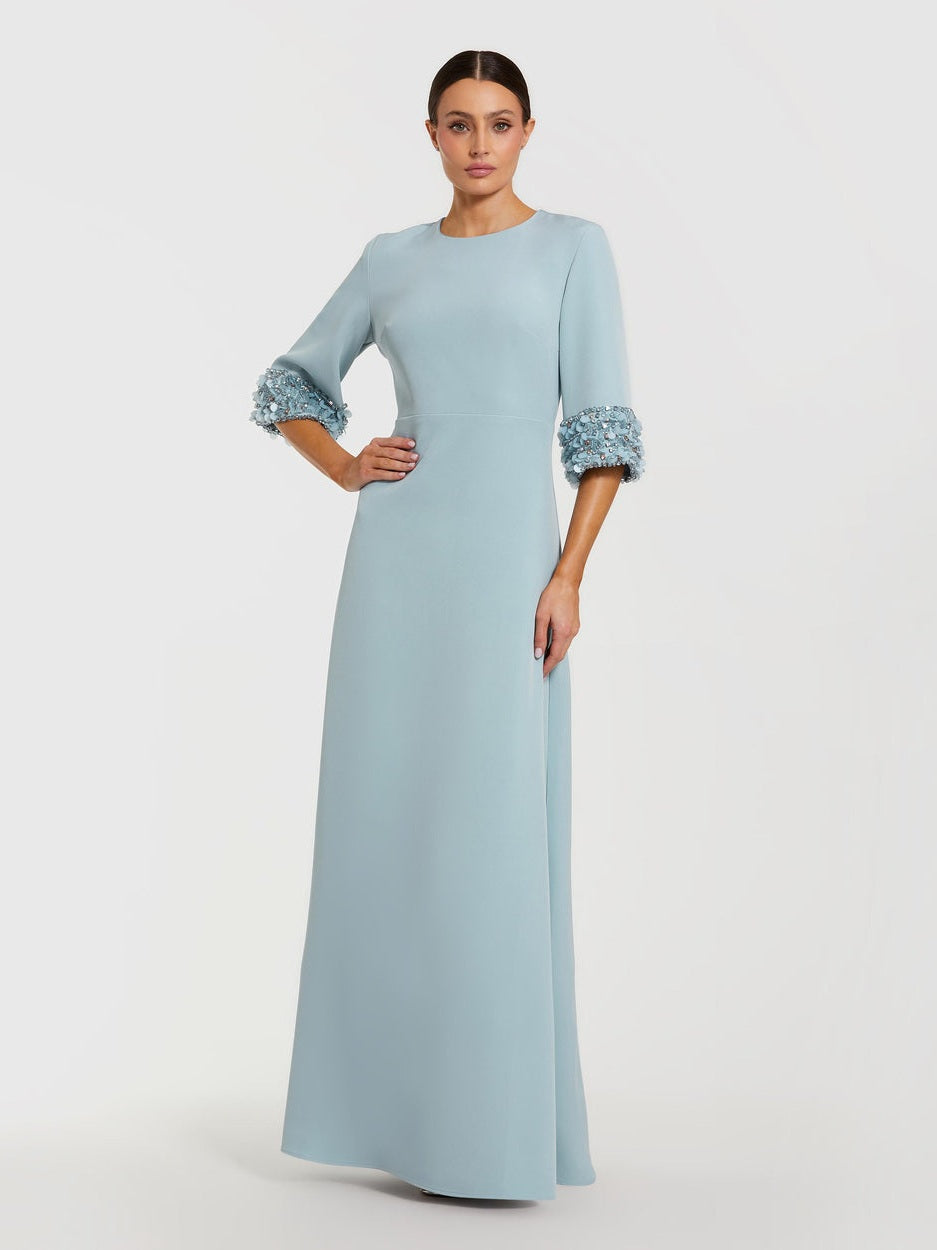 Blue a-line crepe gown with embellished 3/4 sleeves