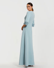 Blue a-line crepe gown with embellished 3/4 sleeves