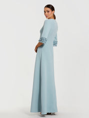 Blue a-line crepe gown with embellished 3/4 sleeves