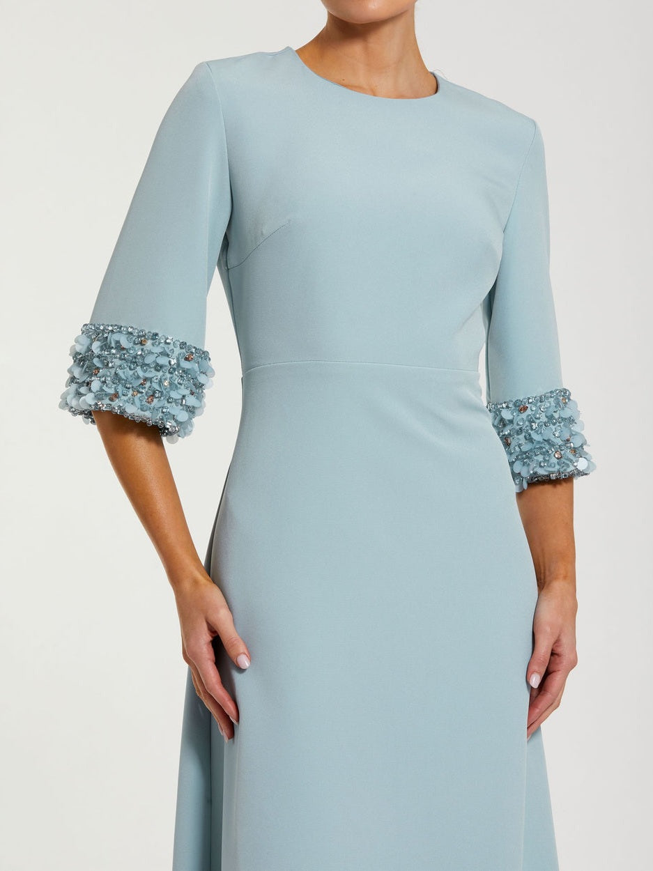 Blue a-line crepe gown with embellished 3/4 sleeves