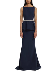 Sleeveless high boatneck gown with flared peplum