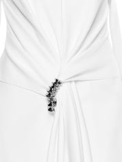 Fitted suit coat featuring front draping accentuated by a premium metal accessory detail