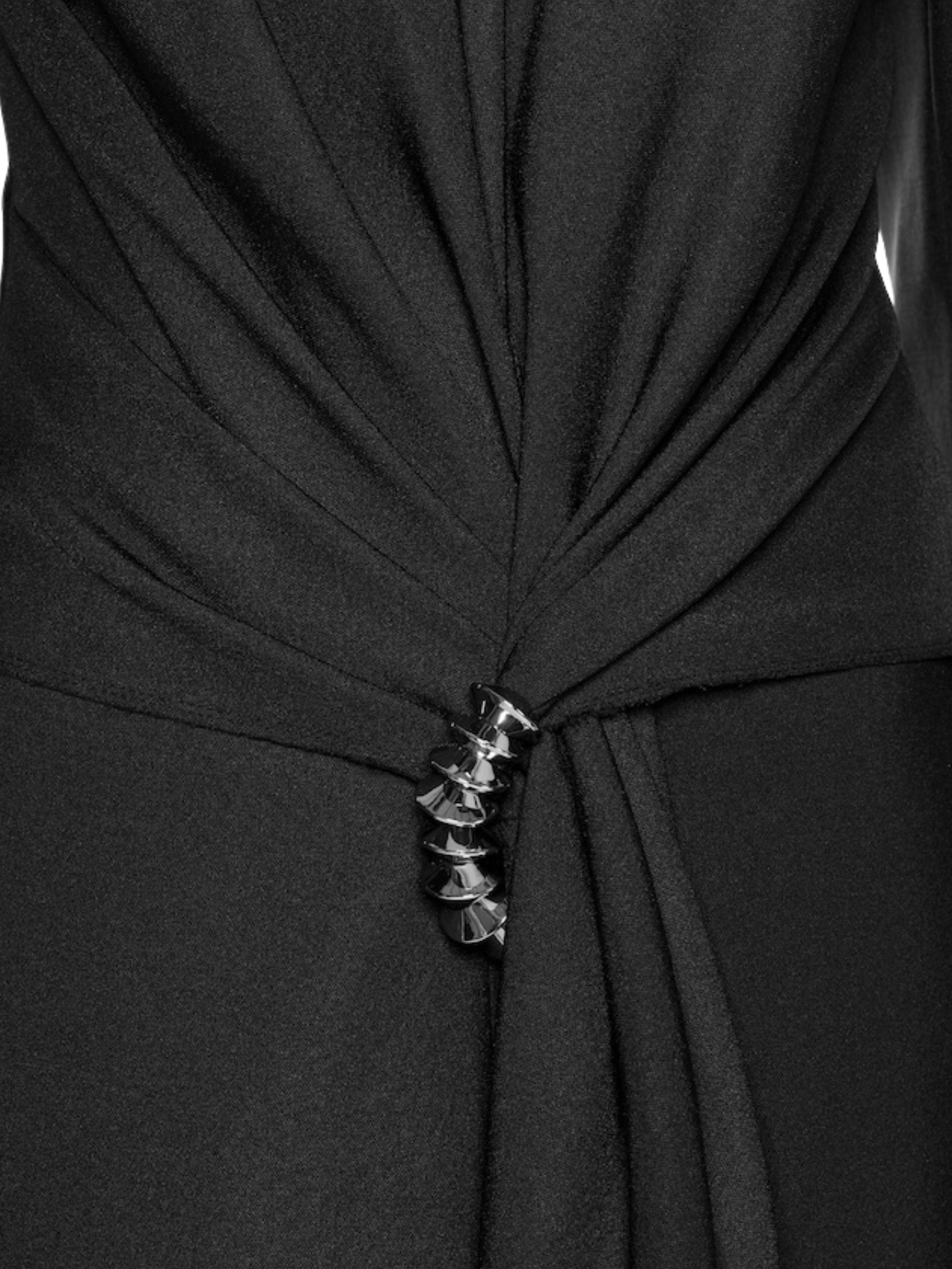 Fitted suit coat featuring front draping accentuated by a premium metal accessory detail