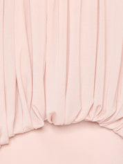 Voluminous halter top featuring a single-layer draped bodice accented with premium metal hardware details