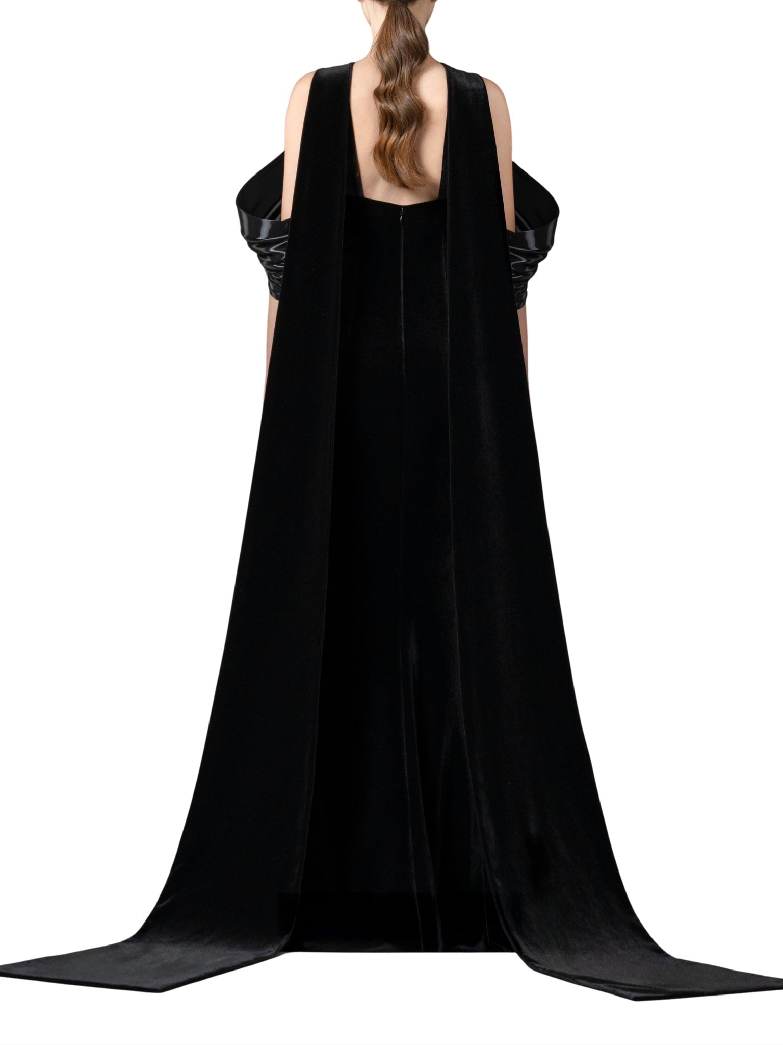 Halter-neck fitted velvet dress featuring a liquid gazar drape