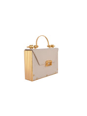 Mahogany cowhide in cream. gold plated brass hardware and alcantara interior with a detachable chain.  h: 12  cm w: 16.4 cm d: 5 cm