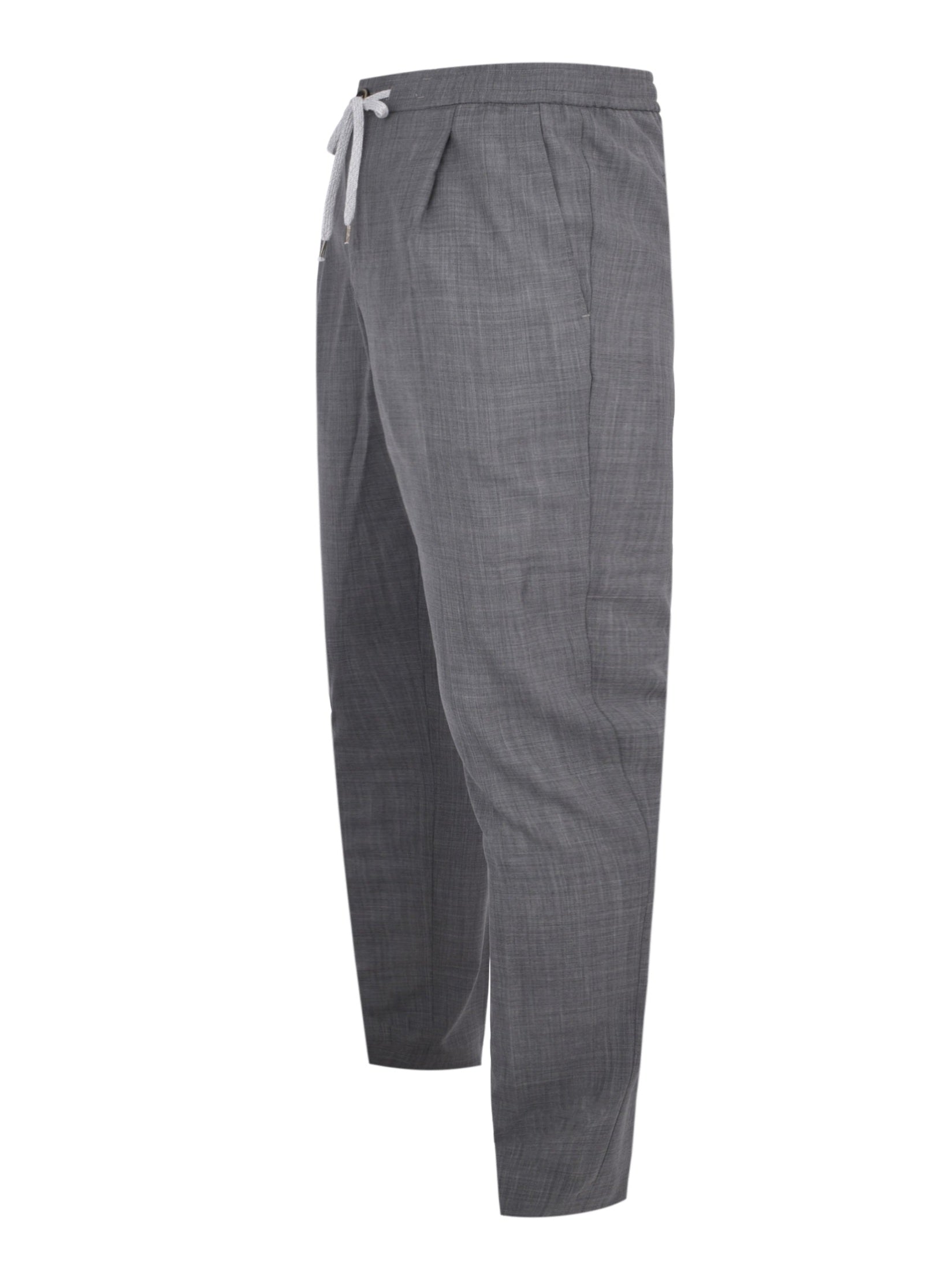 Pantalone soft 1 pleats diagonal pkts zipped back pkts leather det elastic w.band external drawstring