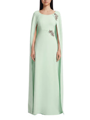 Full-length fitted cape gown with an a-line skirt