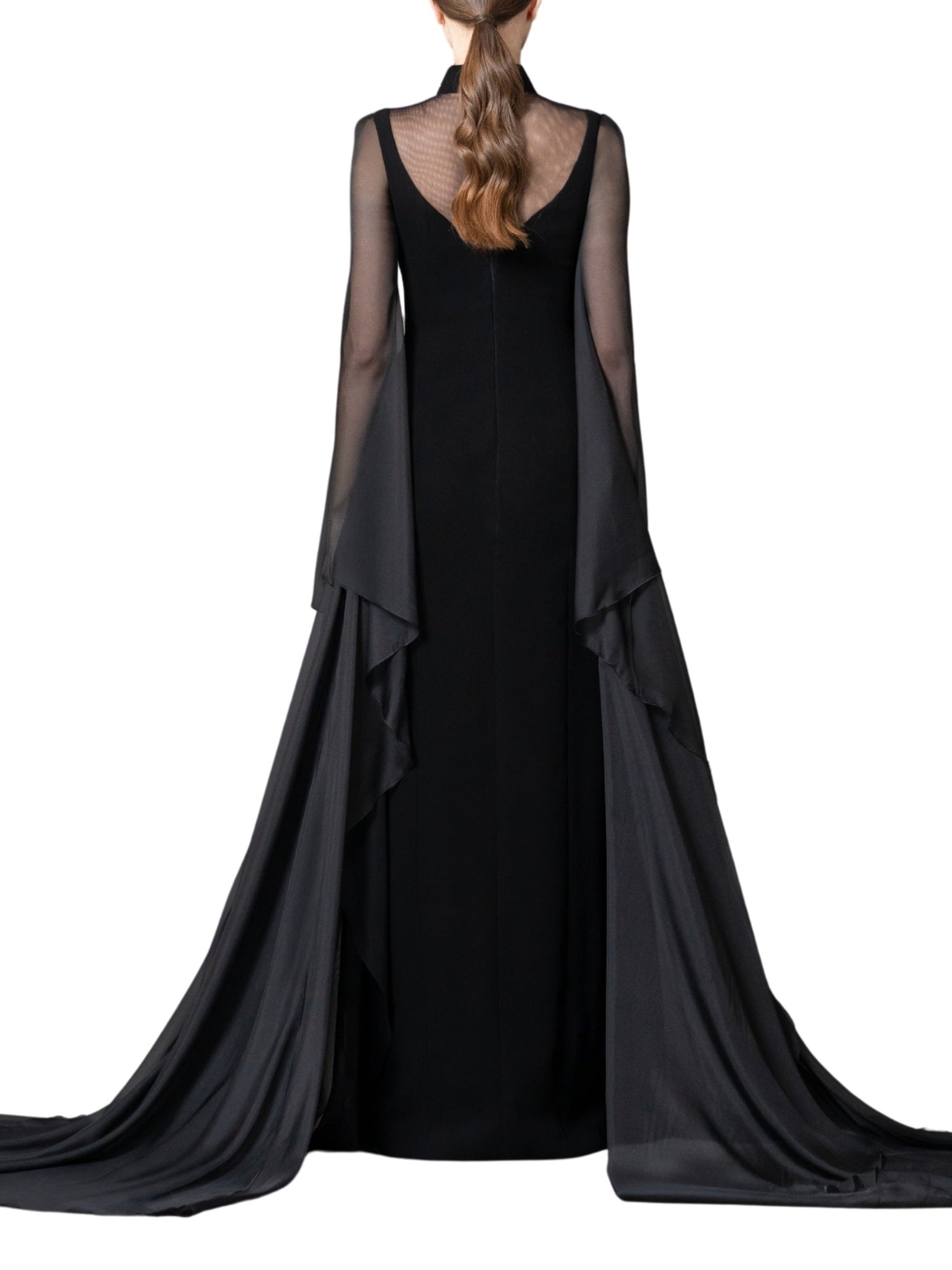 A high-neck gown featuring a crystal-embellished collar and cascading chiffon sleeves with chiffon godets that create a flowing movement.