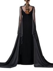 A high-neck gown featuring a crystal-embellished collar and cascading chiffon sleeves with chiffon godets that create a flowing movement.