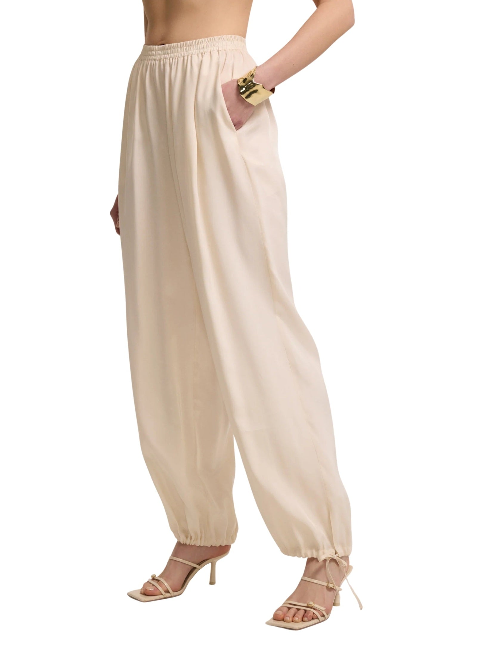 Light beige trousers with drawstring legs