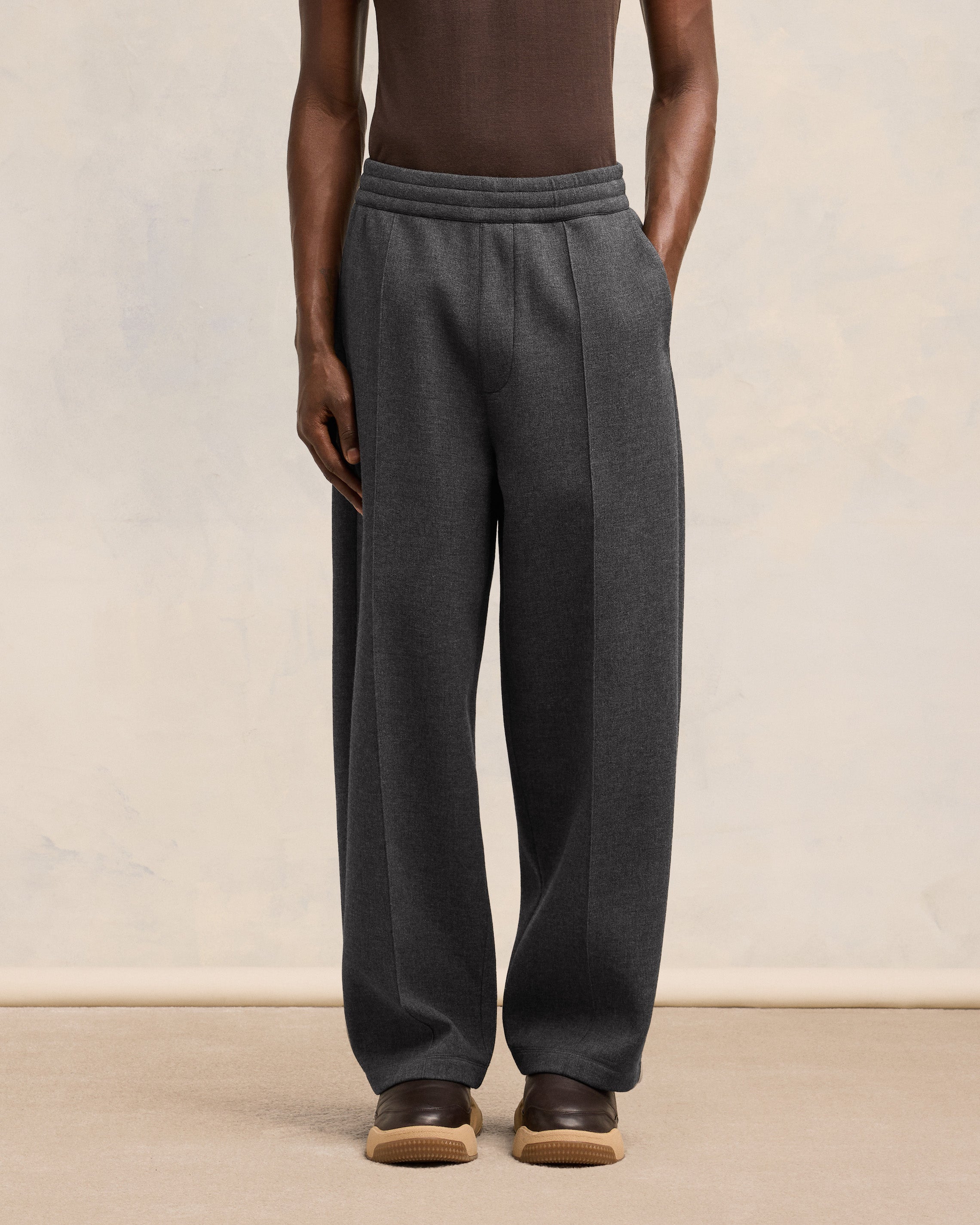 Ami Pleated Trousers Pleated trousers in bonded wool viscose canvas.