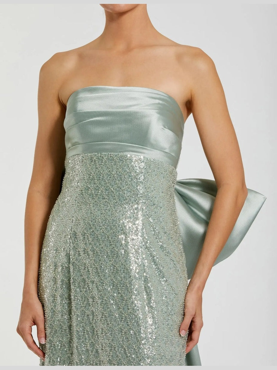 Green strapless embellished gown with back bow detail