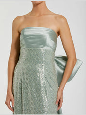 Green strapless embellished gown with back bow detail