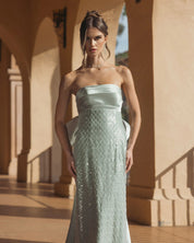 Green strapless embellished gown with back bow detail