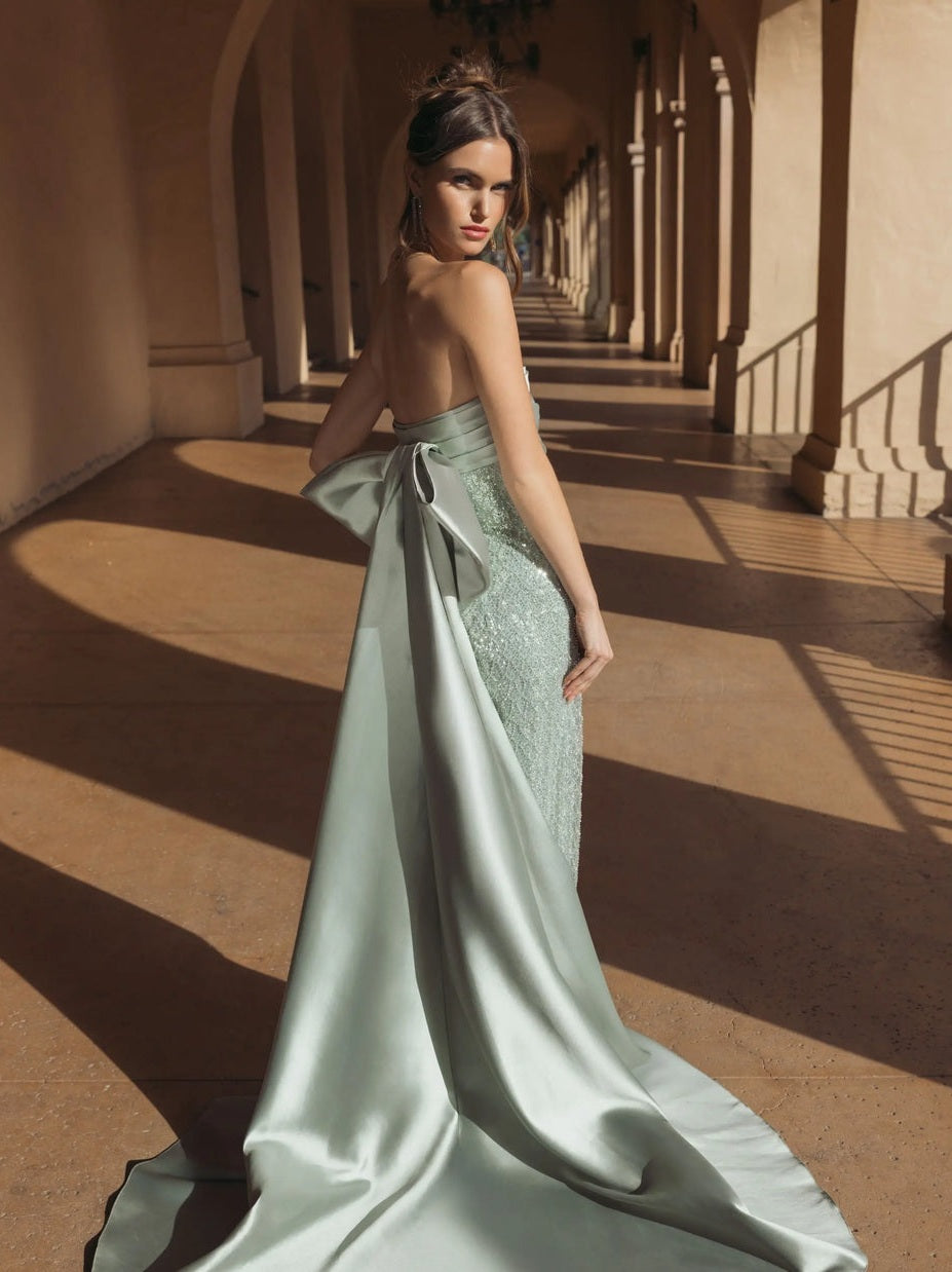 Green strapless embellished gown with back bow detail