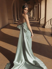 Green strapless embellished gown with back bow detail