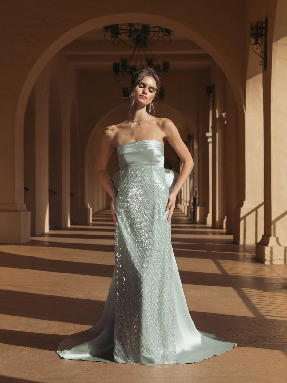 Green strapless embellished gown with back bow detail