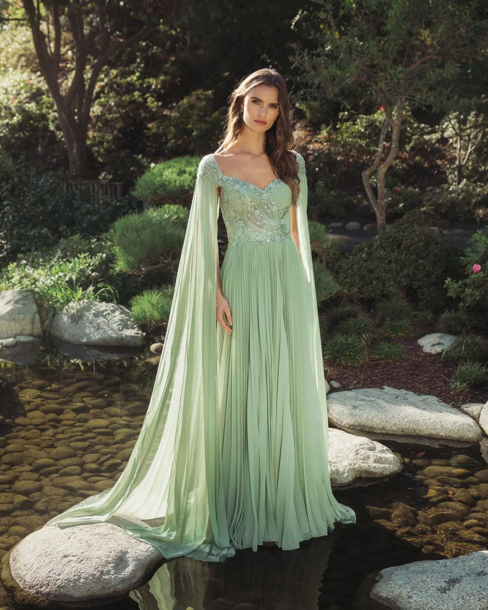 Green embellished chiffon cape sleeve a-line gown