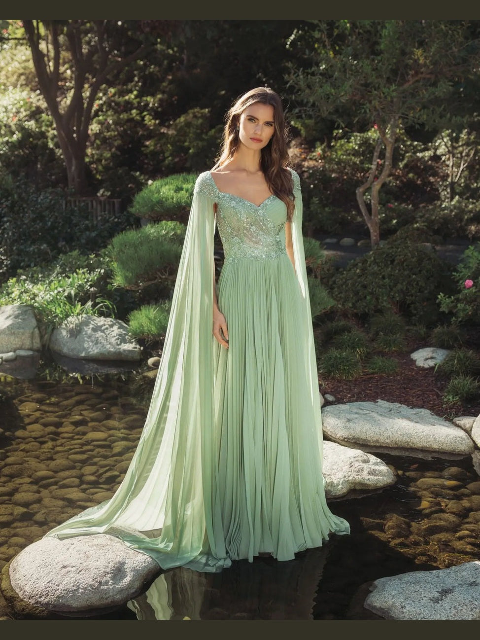Green embellished chiffon cape sleeve a-line gown