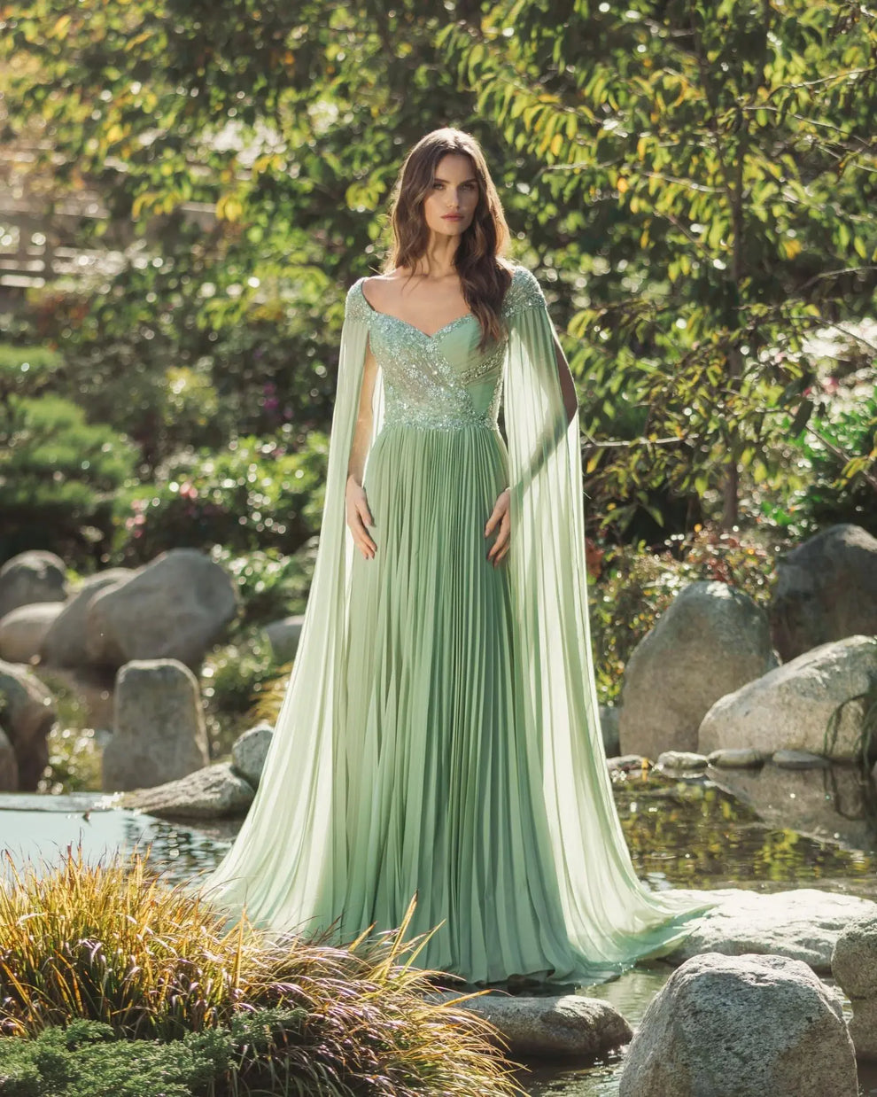 Green embellished chiffon cape sleeve a-line gown