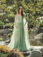 Green embellished chiffon cape sleeve a-line gown