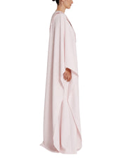 Asymmetric gown with drapped sleeve detail