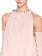 Long voluminous dress featuring a two-layer draped bodice accented with premium metal hardware details