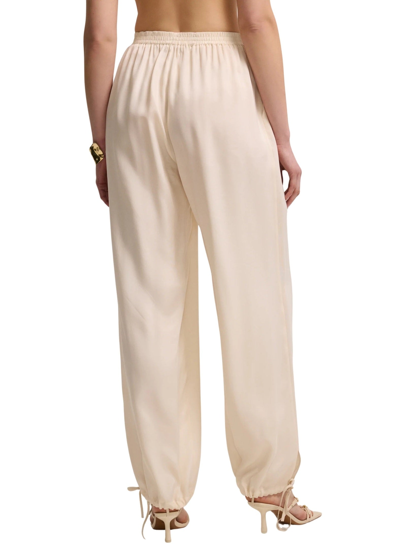 Light beige trousers with drawstring legs