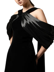 Halter-neck fitted velvet dress featuring a liquid gazar drape