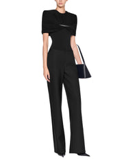 Low-rise flared trousers with a back slit accented with a metal accessory