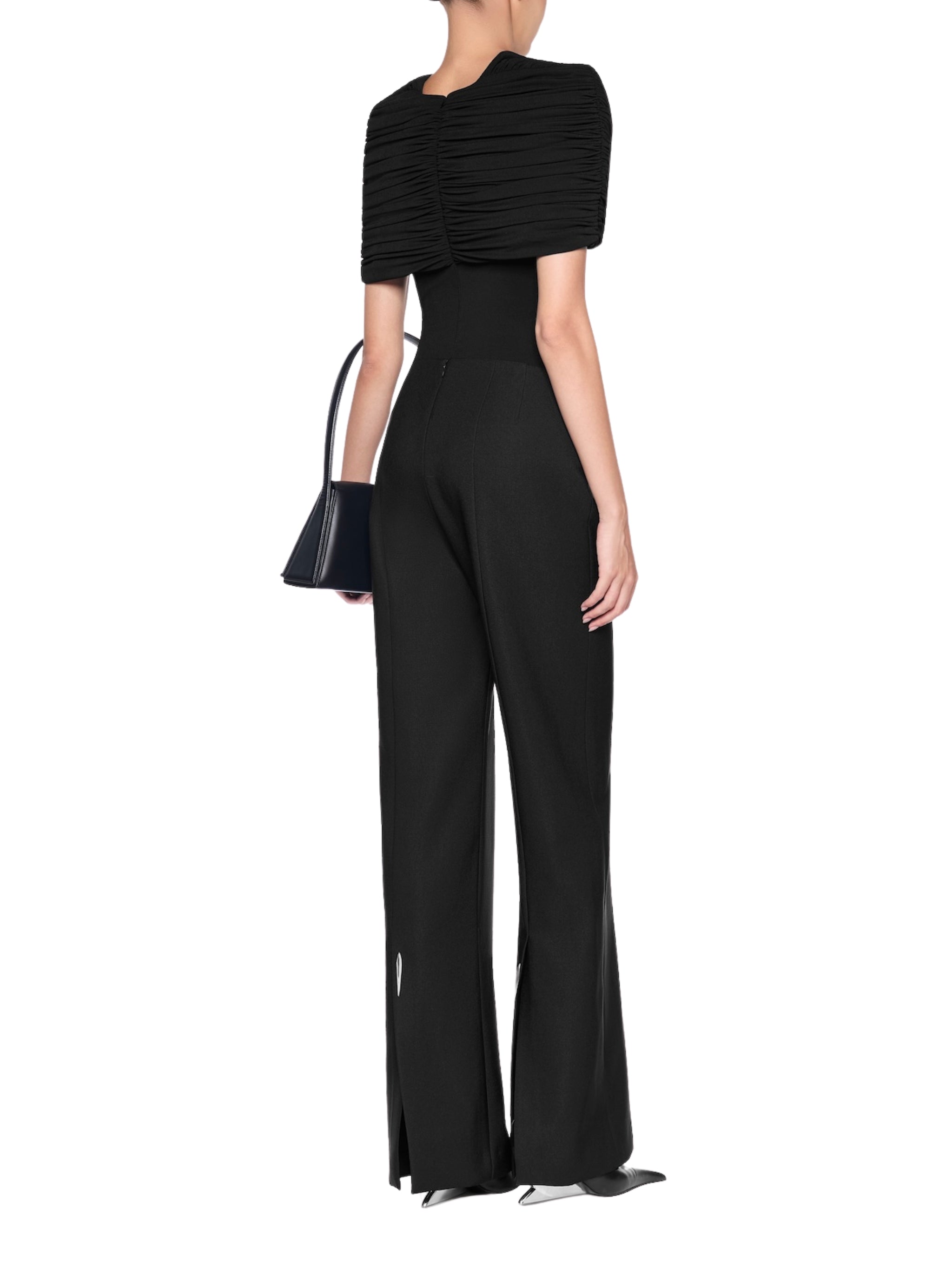 Low-rise flared trousers with a back slit accented with a metal accessory