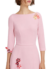 Sharp boat neck gown with asymmetric godets