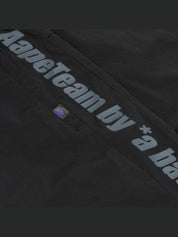 Moonface logo tape track pants