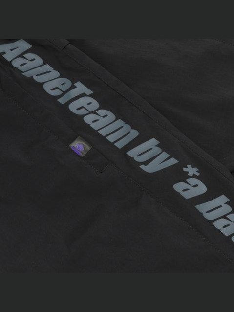 Moonface logo tape track pants