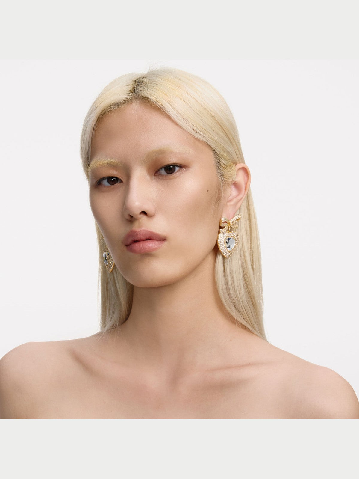 Gold bow crystal heart earrings