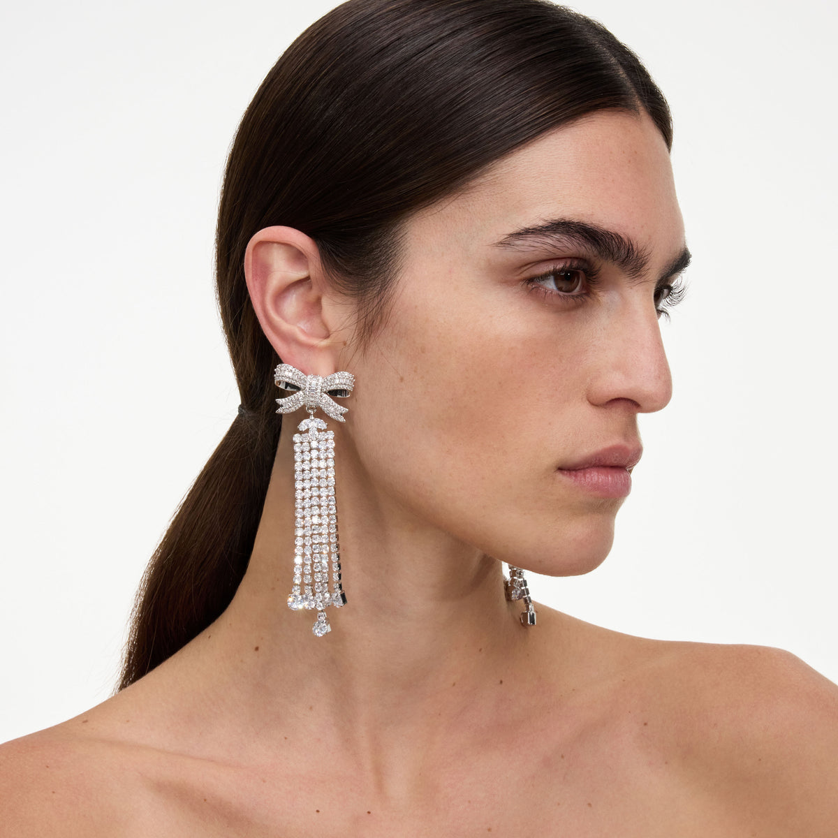Silver crystal bow droplet earrings