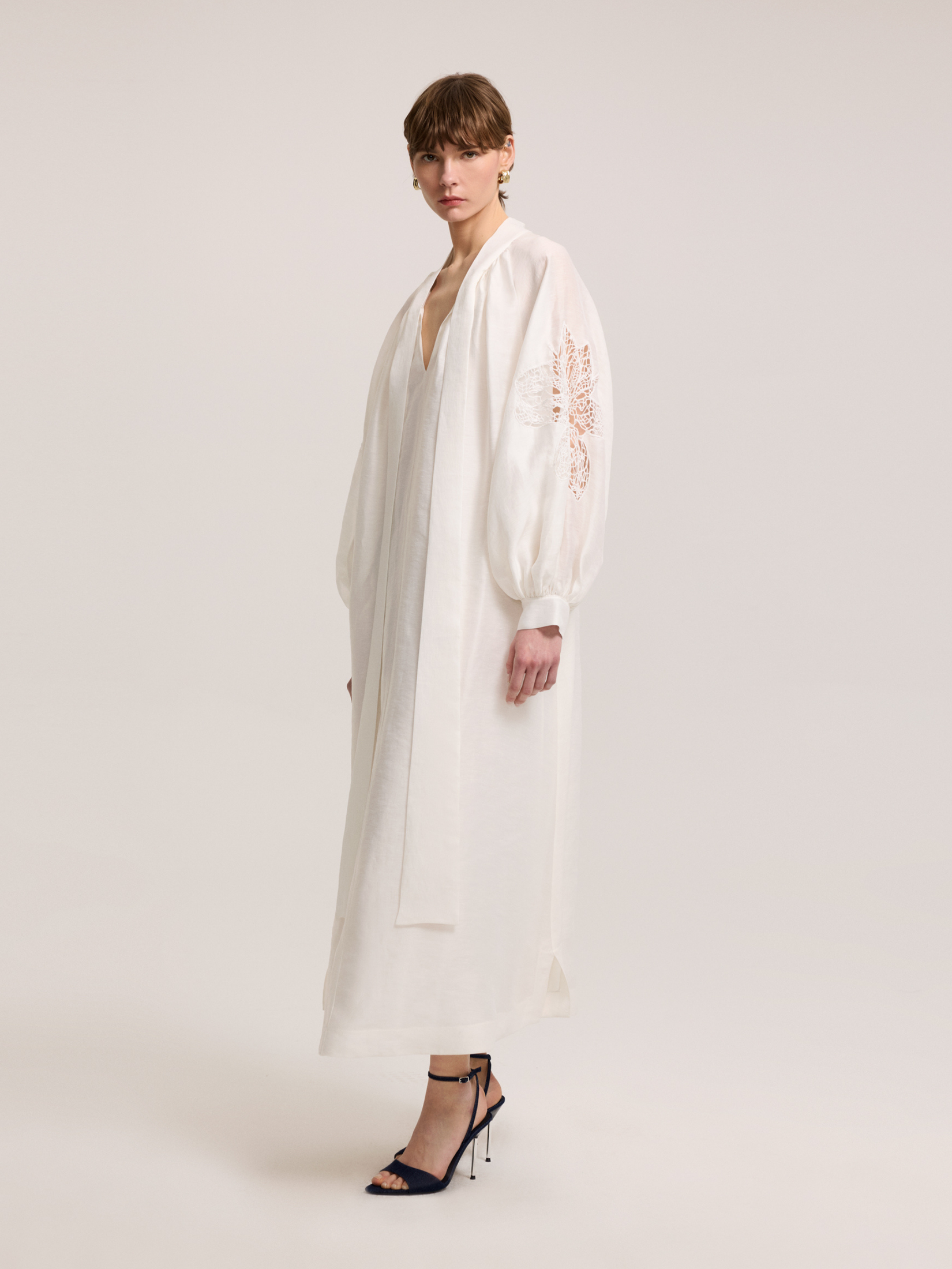 White dress with lace detail on sleeves