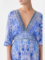 Waisted dress with hem ruffle