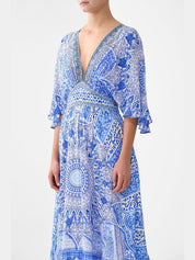 Waisted dress with hem ruffle