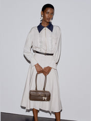 Brown leather baguette shoulder bag with charm