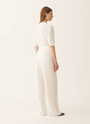 White cotton and linen pants with sequins