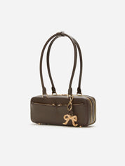 Brown leather baguette shoulder bag with charm