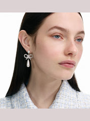 Pearl bow droplet earrings