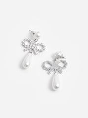 Pearl bow droplet earrings